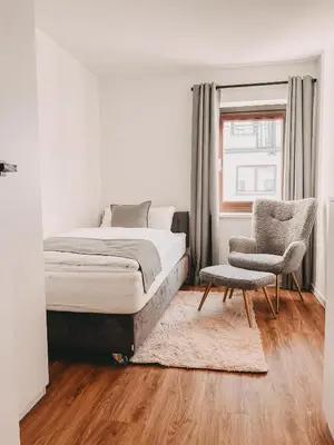 Ein Bett oder Betten in einem Zimmer der Unterkunft Dorf 70