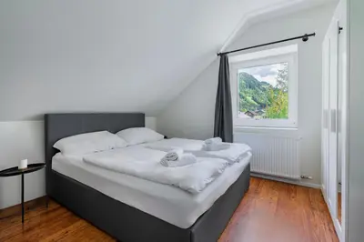 Ein Bett oder Betten in einem Zimmer der Unterkunft homy Alpenlodge