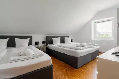 Ein Bett oder Betten in einem Zimmer der Unterkunft homy Alpenlodge